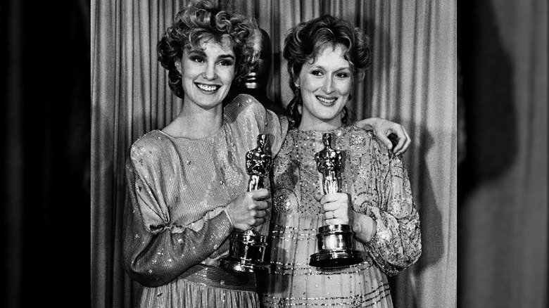 Jessica Lange and Meryl Streep holding Oscars together 