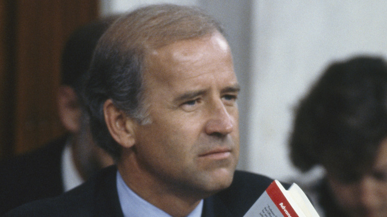 Joe Biden holding a book