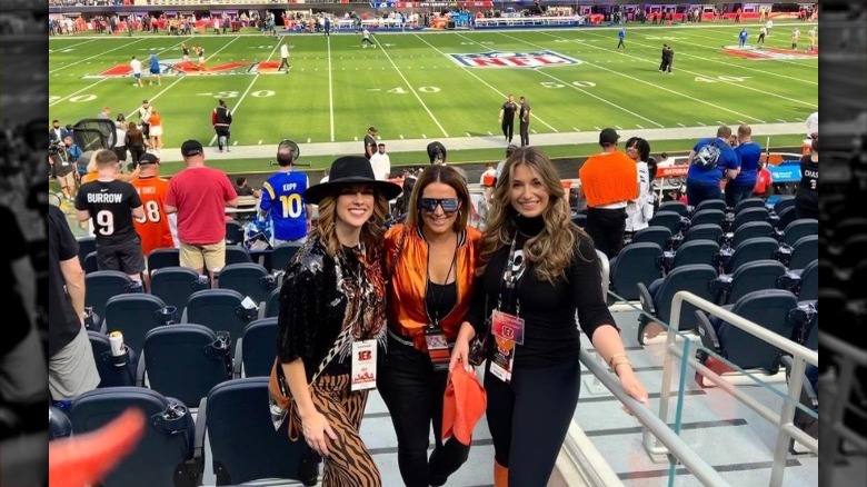 Olivia Holzmacher smiling with friends