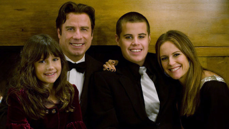 John Travolta smiling with daughter Ella, son Jett, and wife Kelly Preston