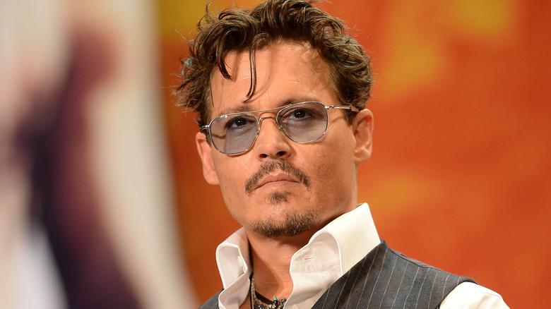 Johnny Depp wearing blue sunglasses