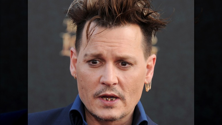 Johnny Depp gold teeth earrings