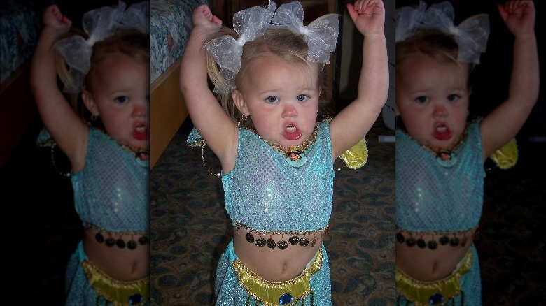 JoJo Siwa in a princess outfit as a toddler.