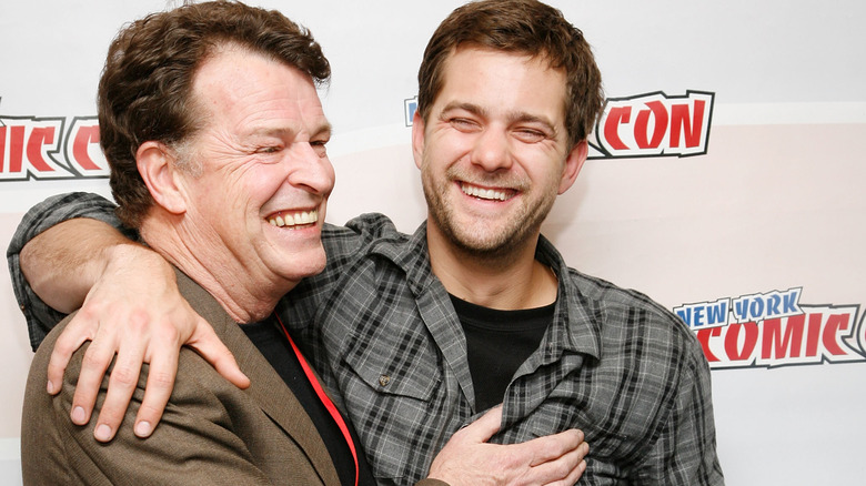 Joshua Jackson with John Noble, hugging