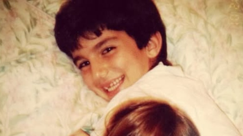 Young Justin Baldoni smiling