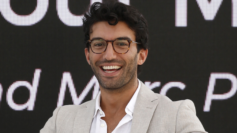 Justin Baldoni smiling on the red carpet