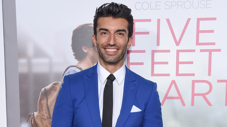 Justin Baldoni smiling on the red carpet