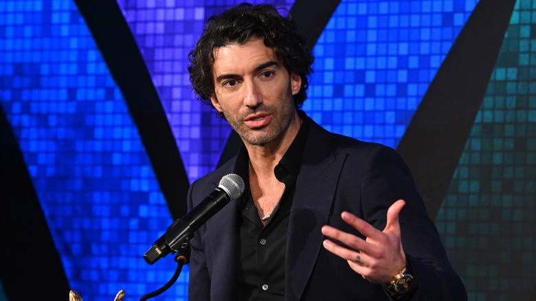 Justin Baldoni speaking on stage