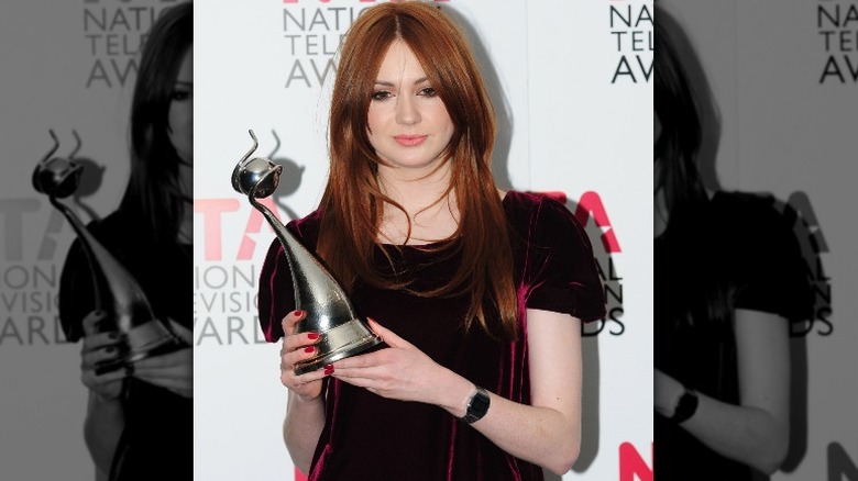 Karen Gillan holding trophy