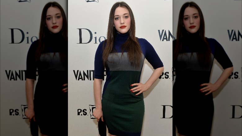 Kat Dennings posing at event