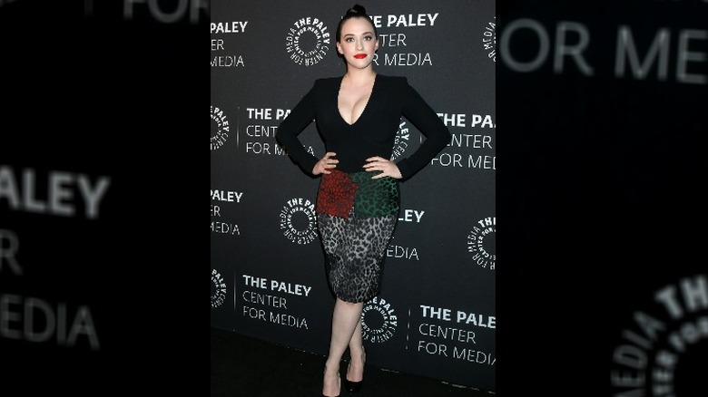 Kat Dennings posing at event