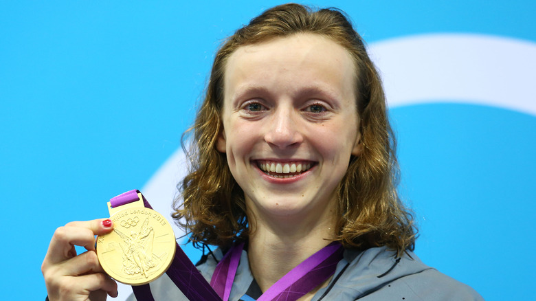 Katie Ledecky holding gold medal