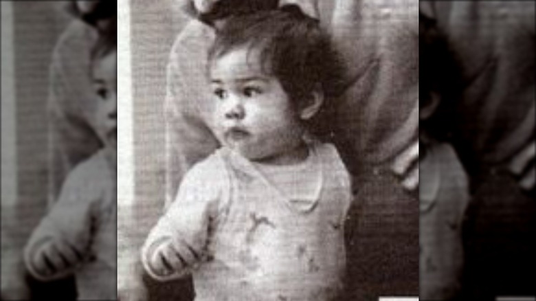 Baby Keanu Reeves in the arms of his father, Samuel