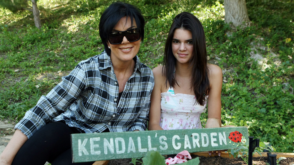 Kris and Kendall Jenner in a garden