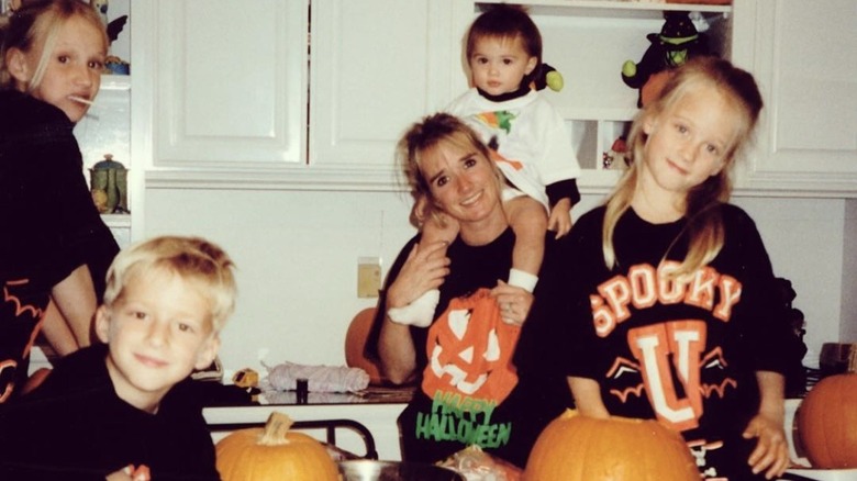 Kim Richards, with her four kids, smiling