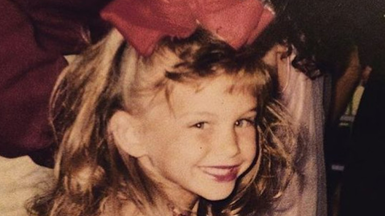 Young Lala Kent wearing red hairbow