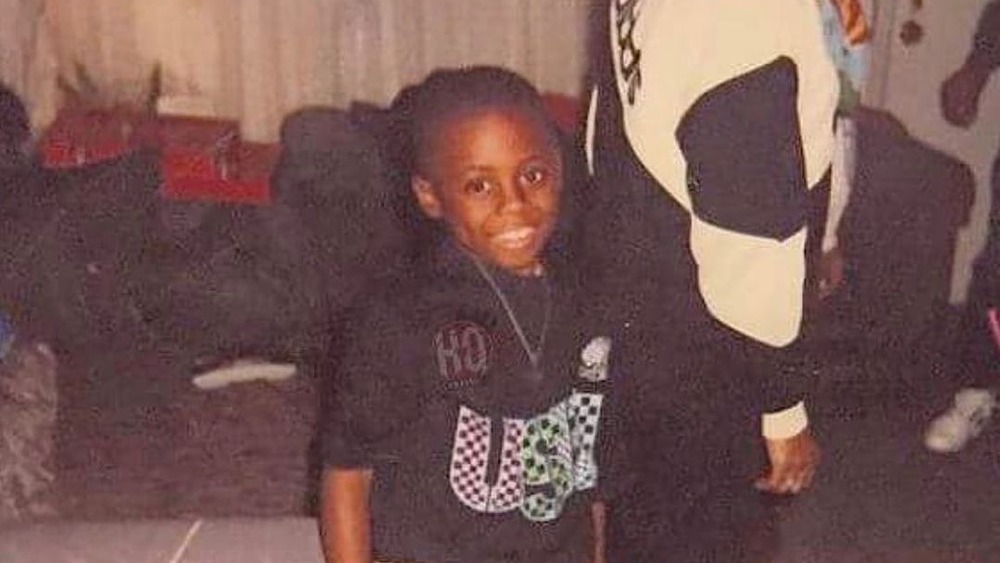 Lil Wayne smiling in childhood photo