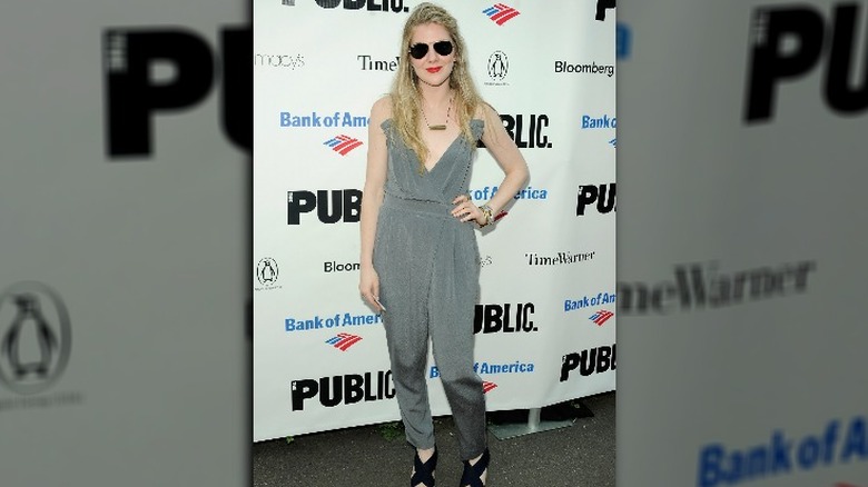 lily rabe wearing sunglasses on the red carpet