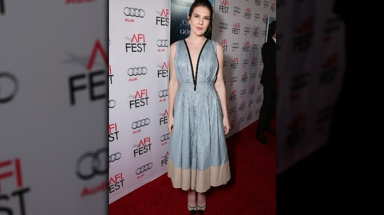 lily rabe posing in a big silver dress