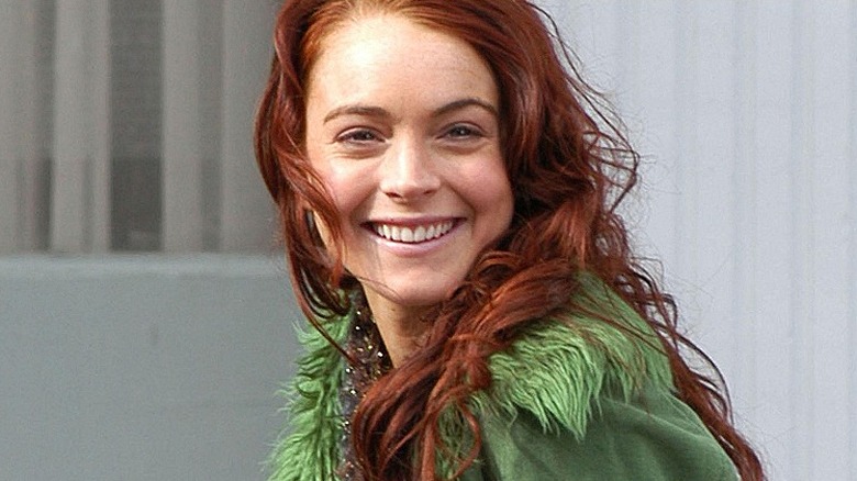 Lindsay Lohan smiling in green top