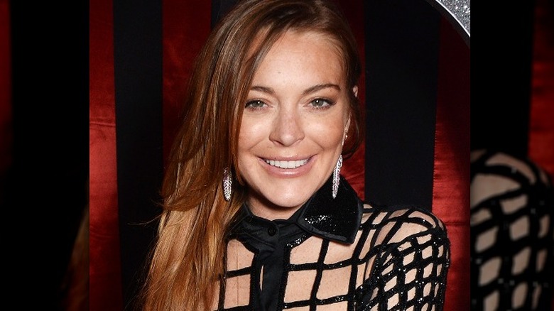 Lindsay Lohan wearing silver feather earrings