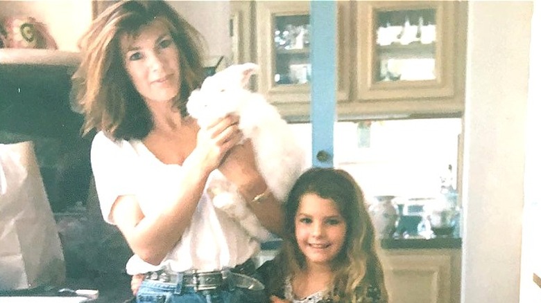 Lisa Vanderpump holding a bunny and standing next to Pandora Vanderpump