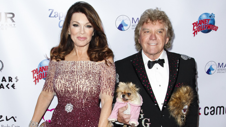 Lisa Vanderpump smiling and Ken Todd smiling and holding Giggy