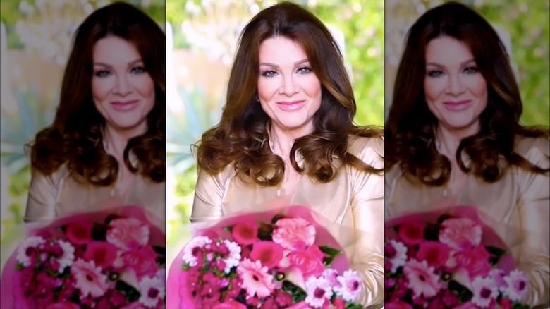 Lisa Vanderpump holding a bouquet of flowers