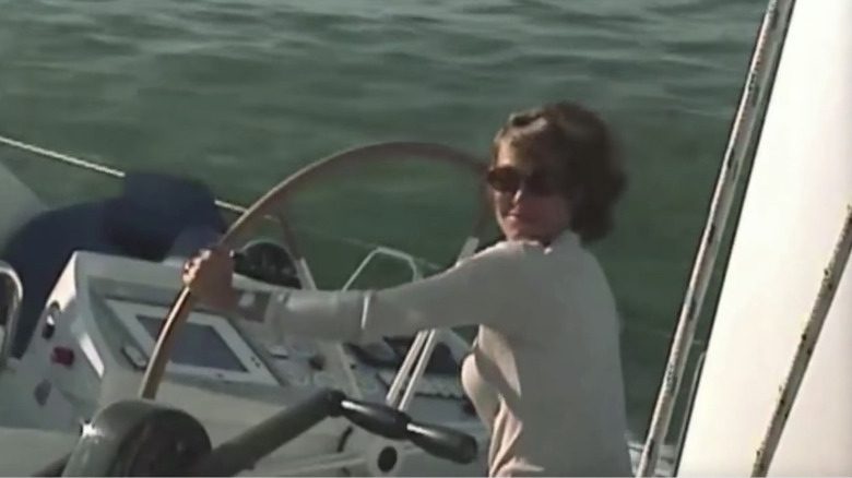 Luann de Lesseps driving a boat