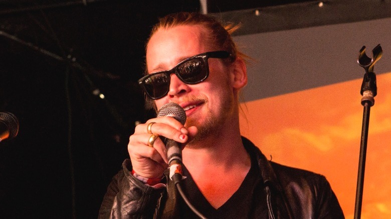 Macaulay Culkin with microphone