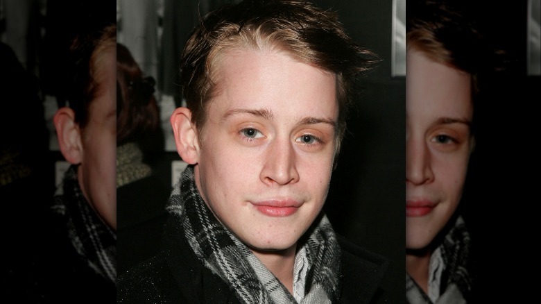 Macaulay Culkin wearing a scarf