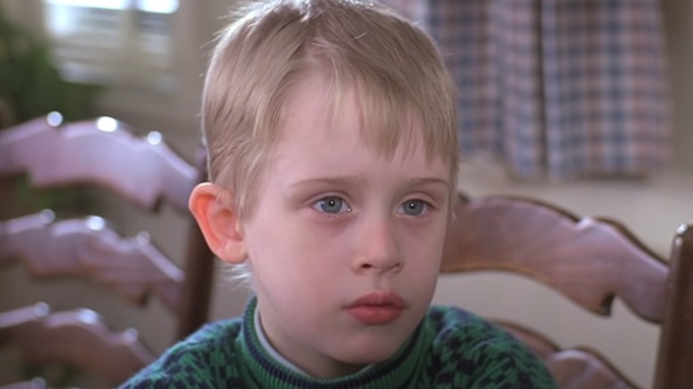 Macaulay Culkin in chair