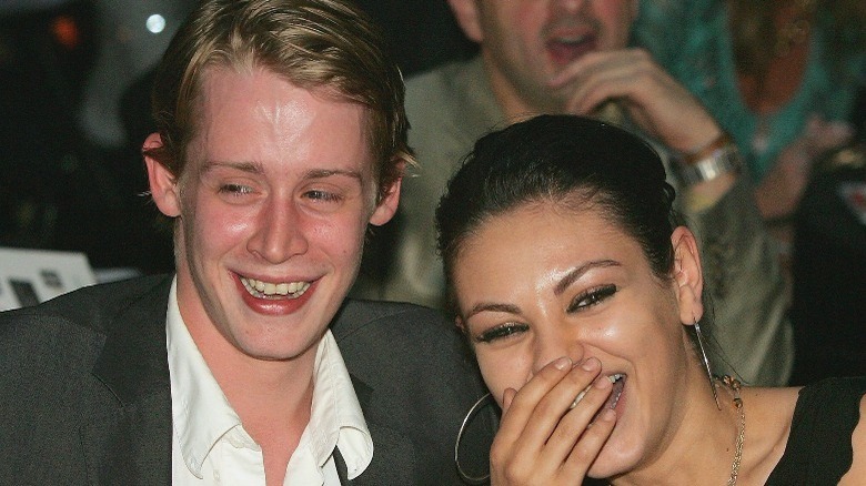 Macaulay Culkin, Mila Kunis laughing
