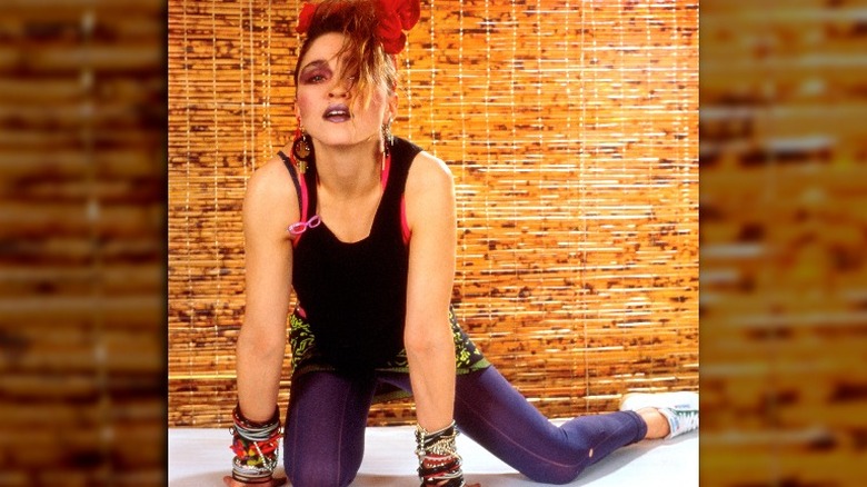 Madonna posing on ground in 1980s 