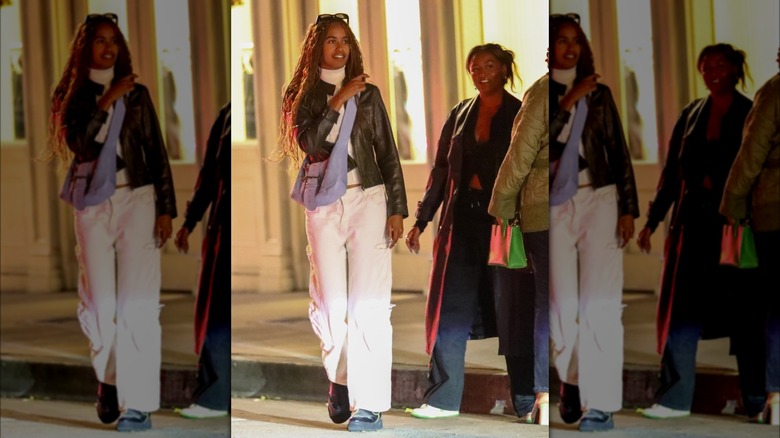 Malia and Sasha Obama walking in street