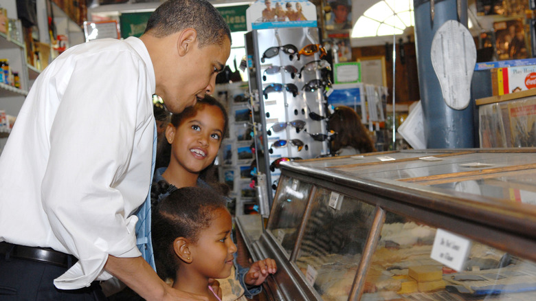 Barack Obama with Malia and Sasha at a store in 2007