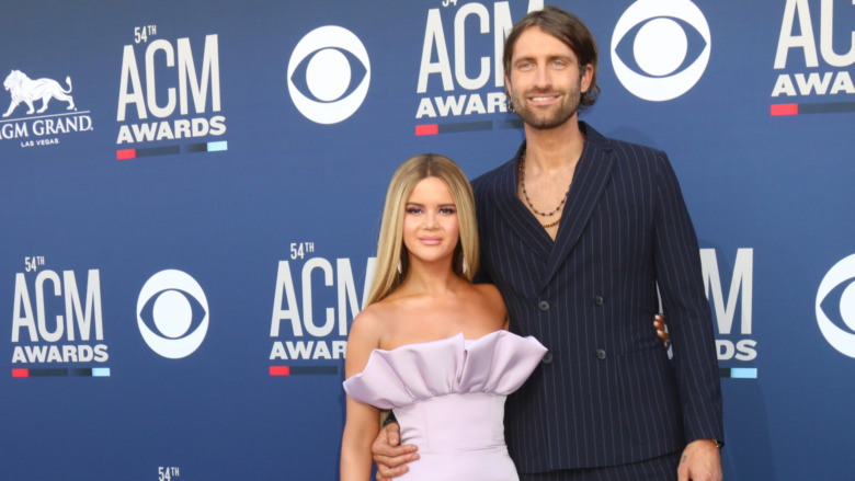 Maren Morris and Ryan Hurd smiling on the red carpet