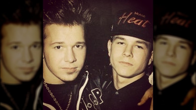 Donnie and Mark Wahlberg in hip hop clothes.