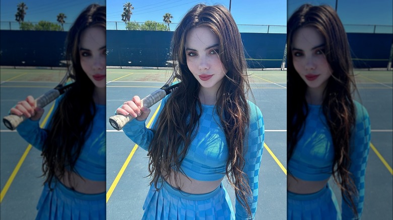 McKayla Maroney holding tennis racket