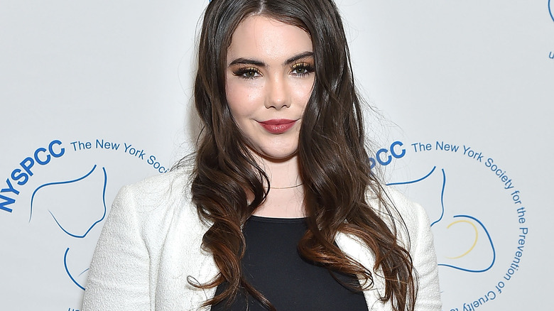 McKayla Maroney in white coat