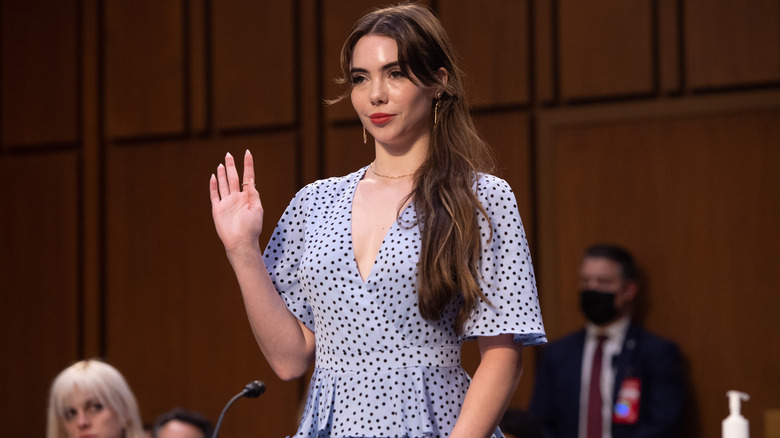 McKayla Maroney raising her hand