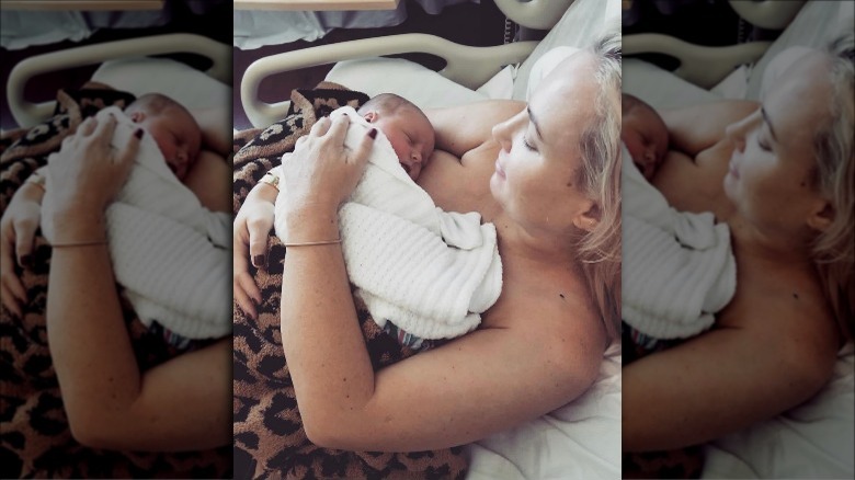 Meghan McCain cradling her newborn daughter Liberty