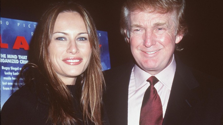 Melania and Donald Trump grinning in 1999