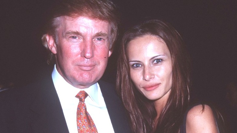 Melania and Donald Trump posing in 1998