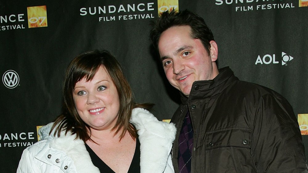 Melissa McCarthy, Ben Falcone smiling while arm-in-am at the Sundance Film Festival
