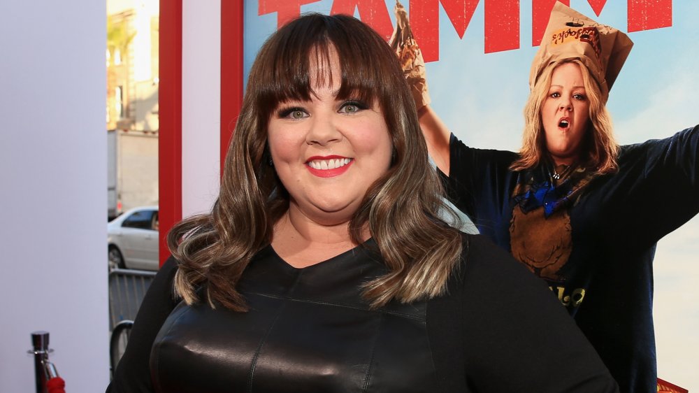 Melissa McCarthy with bangs, smiling at the Tammy premiere