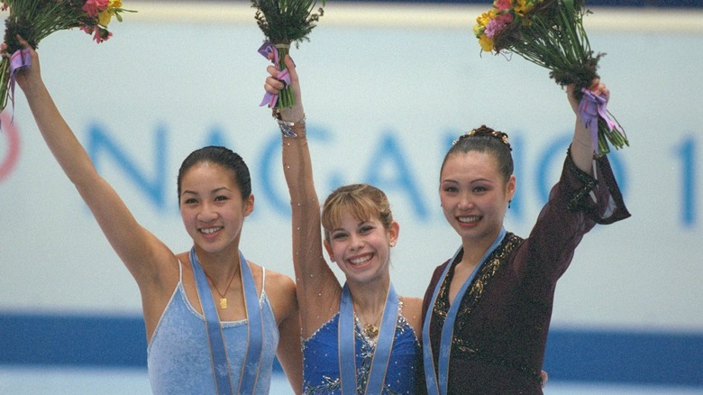 Michelle Kwan with other medalists, waving