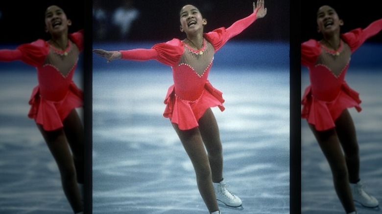 Michelle Kwan smiles while skating