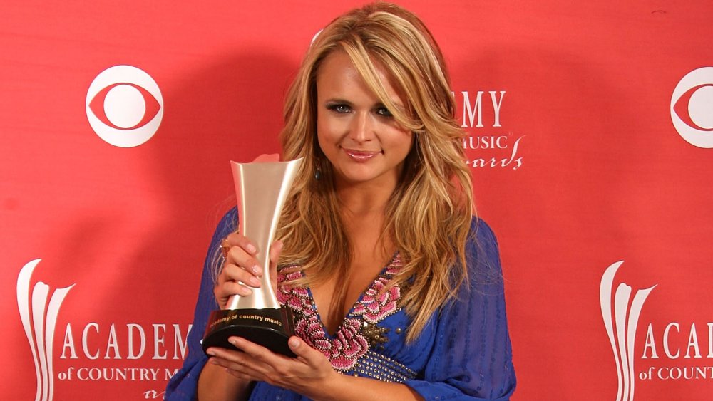 Miranda Lambert holding her Academy of Country Music Award