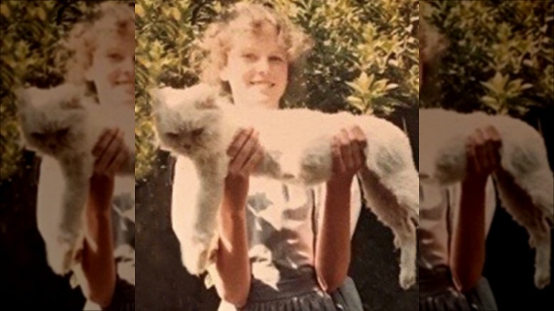 Young Nicole Kidman holding a cat